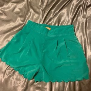 Green scalloped shorts